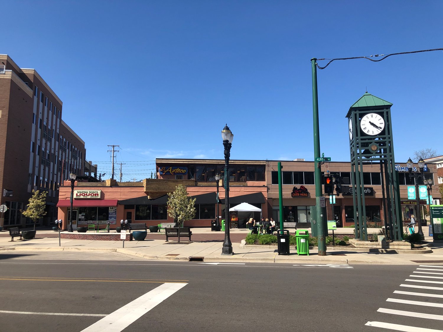 Nearly empty Albert Street in downtown East Lansing. Now, imagine picnic tables in the street so people can dine safely on food and beverages -- including alcoholic ones -- from downtown establishments. A committee is working on just such an idea.