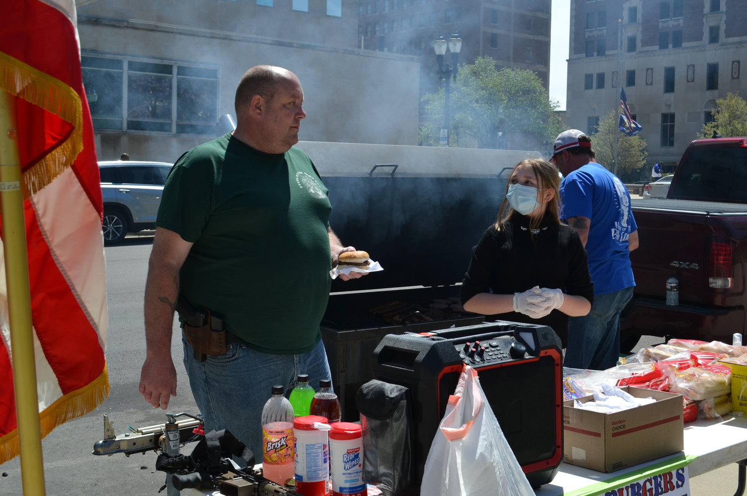 A burger stand distributes food to protesters.
