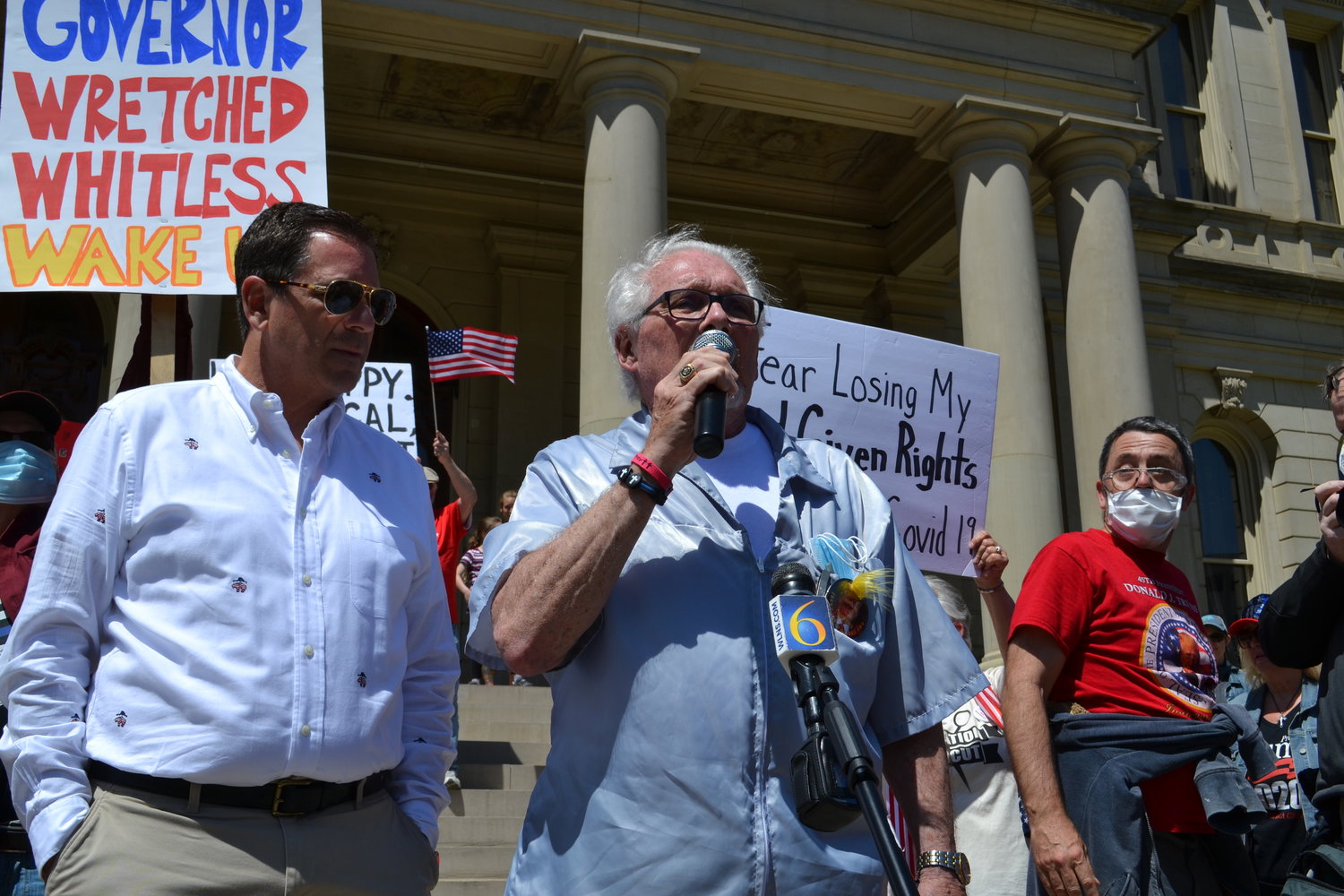 Rogue Owosso barber Karl Manke, whose business license was pulled after he refused to close, briefly spoke from the Capitol steps and was expected to give haircuts throughout the afternoon. At one point, he compared the lockdown to the Holocaust to thunderous applause. 