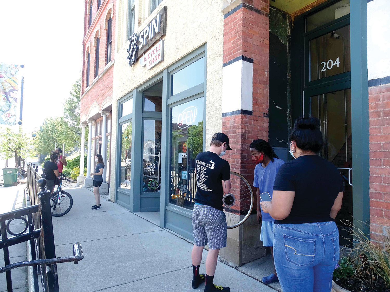 Staffers were busy helping a constant stream of socially distancing customers outside  Spin Bicycle Shop in Old Town Tuesday.