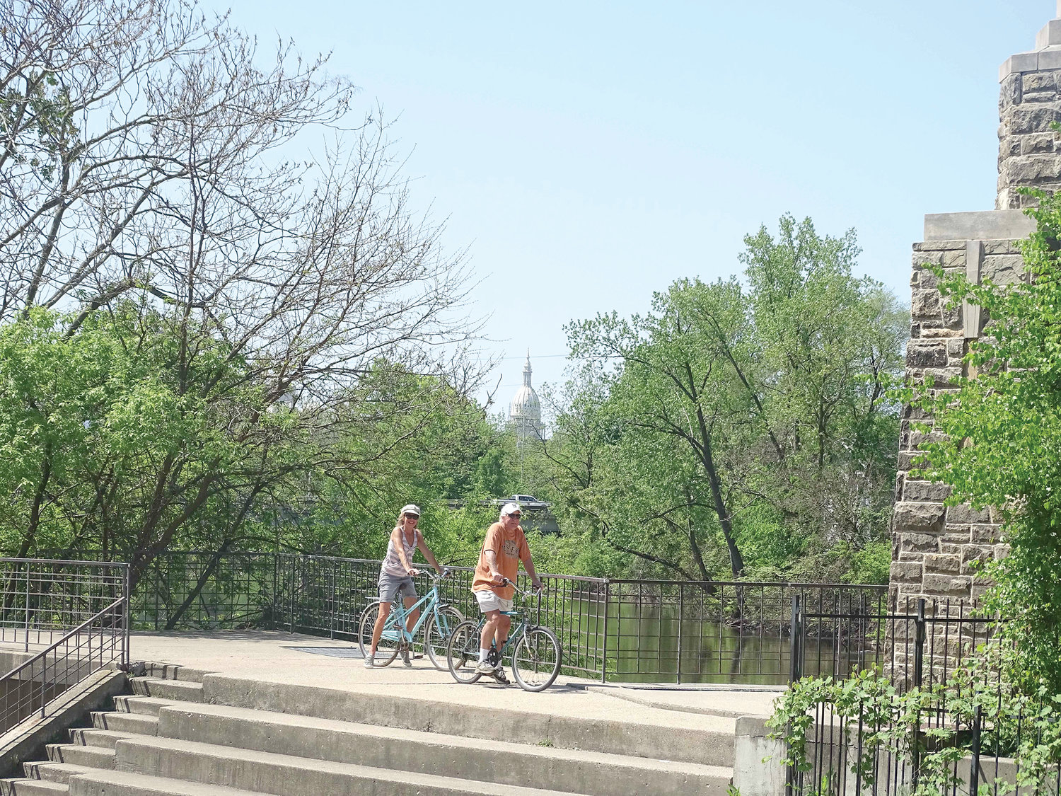 The Brenke Fish Ladder is a popular stop for bicyclists on the Lansing River Trail.