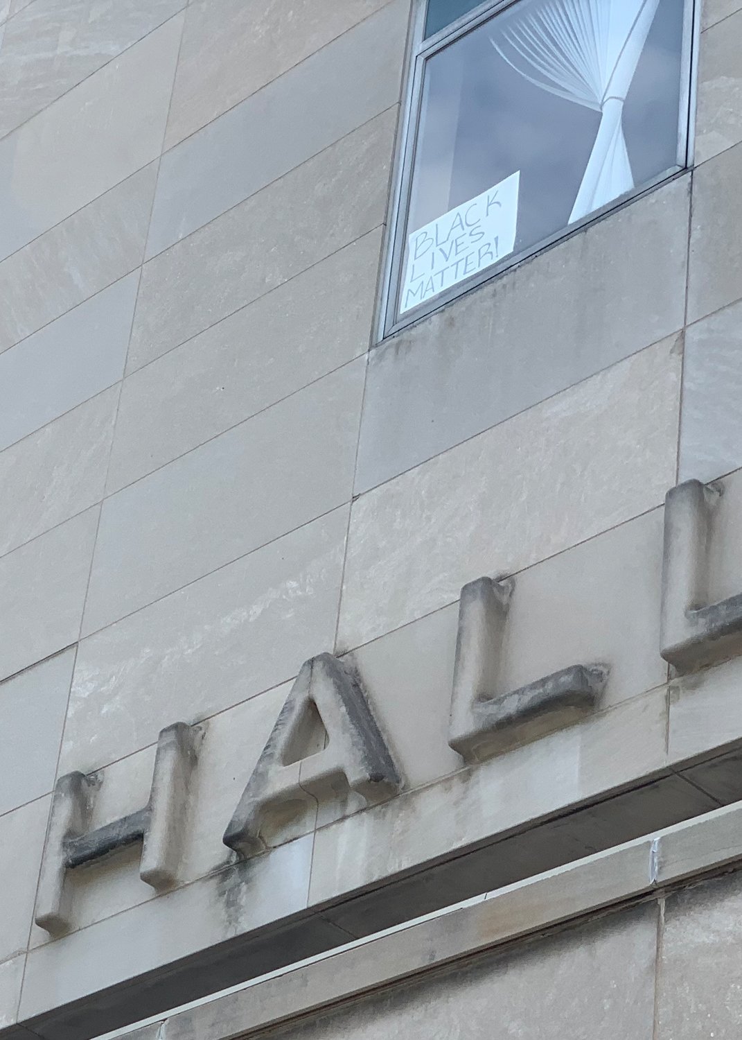 A "Black Lives Matter" sign in a window at City Hall.