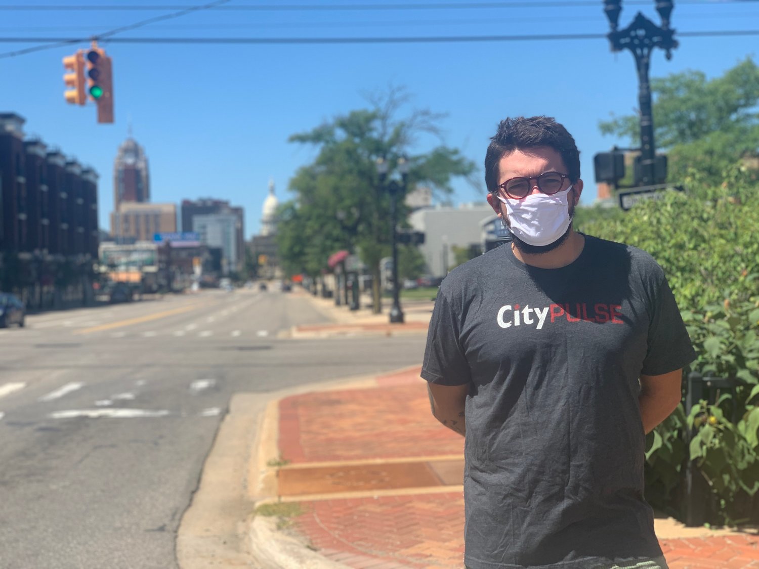City Pulse staff member Kyle Kaminski near where his car was parked at Michigan Avenue and Larch Street in downtown Lansing.