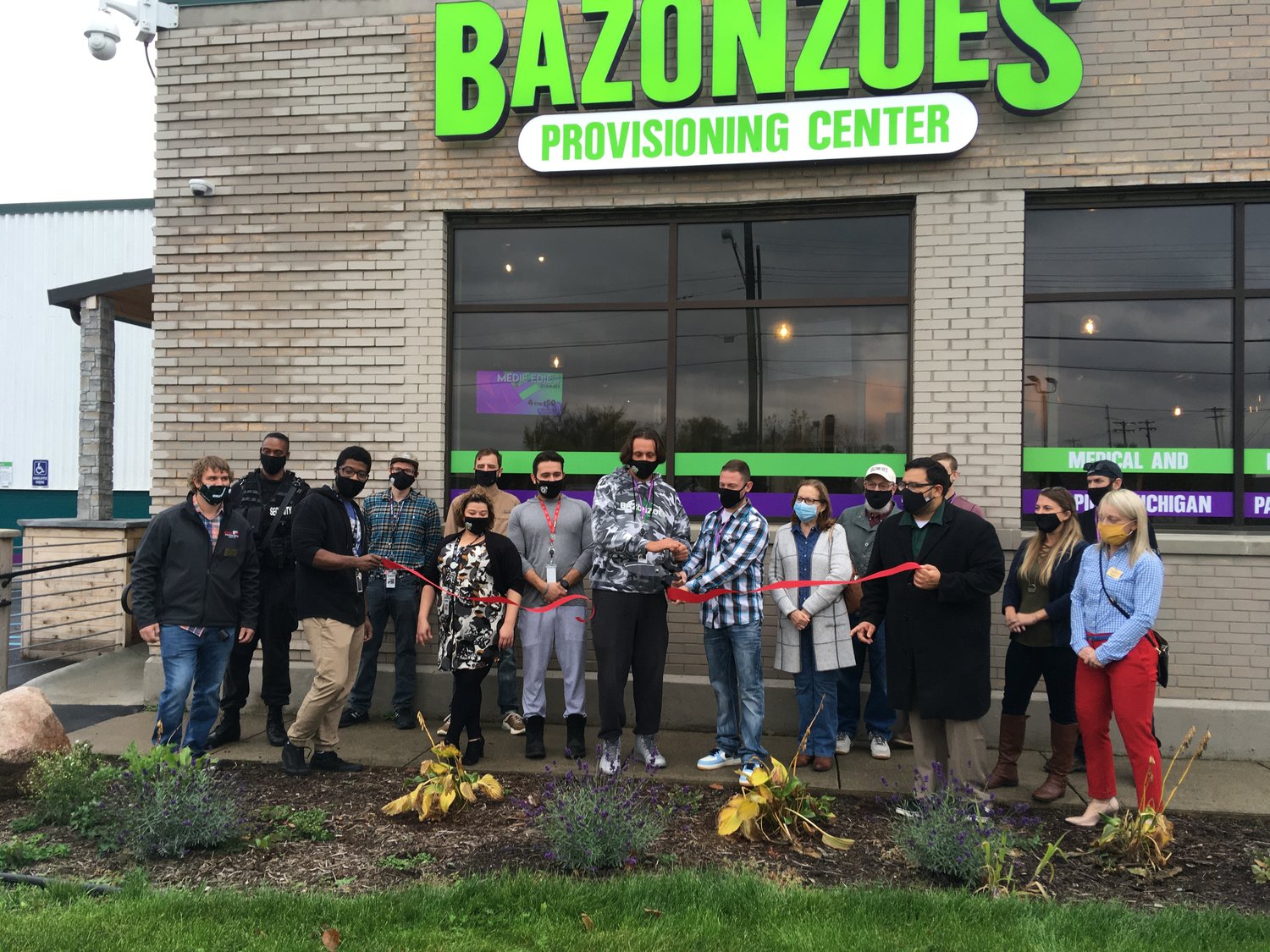 Employees of Bazonzoes Provisioning Center at 2101 W. Willow Highway in Lansing celebrated the business opening with a ribbon cutting today.