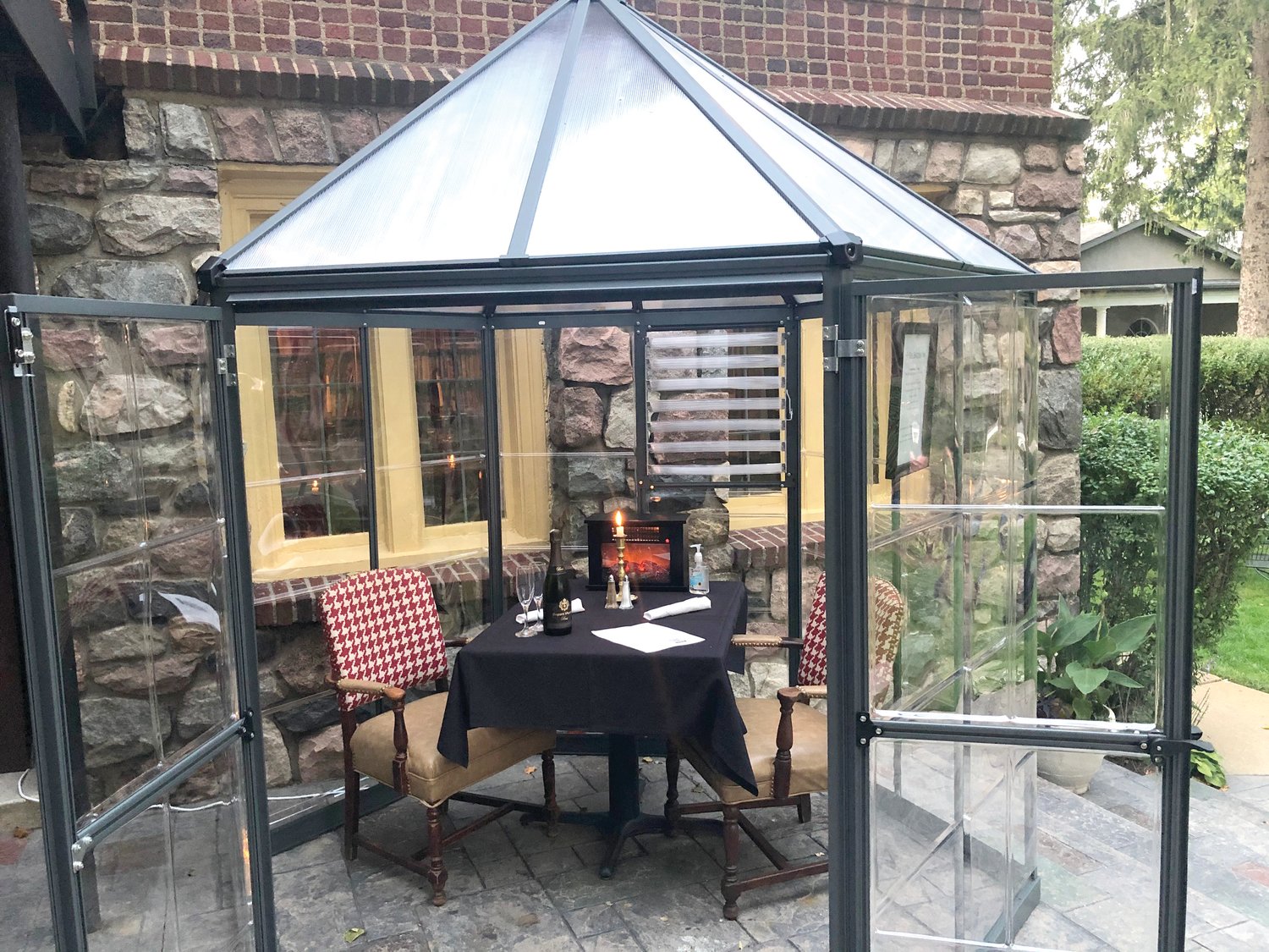 One of English Inn's heated greenhouse-style outdoor booths. They can accommodate parties of two to six.
