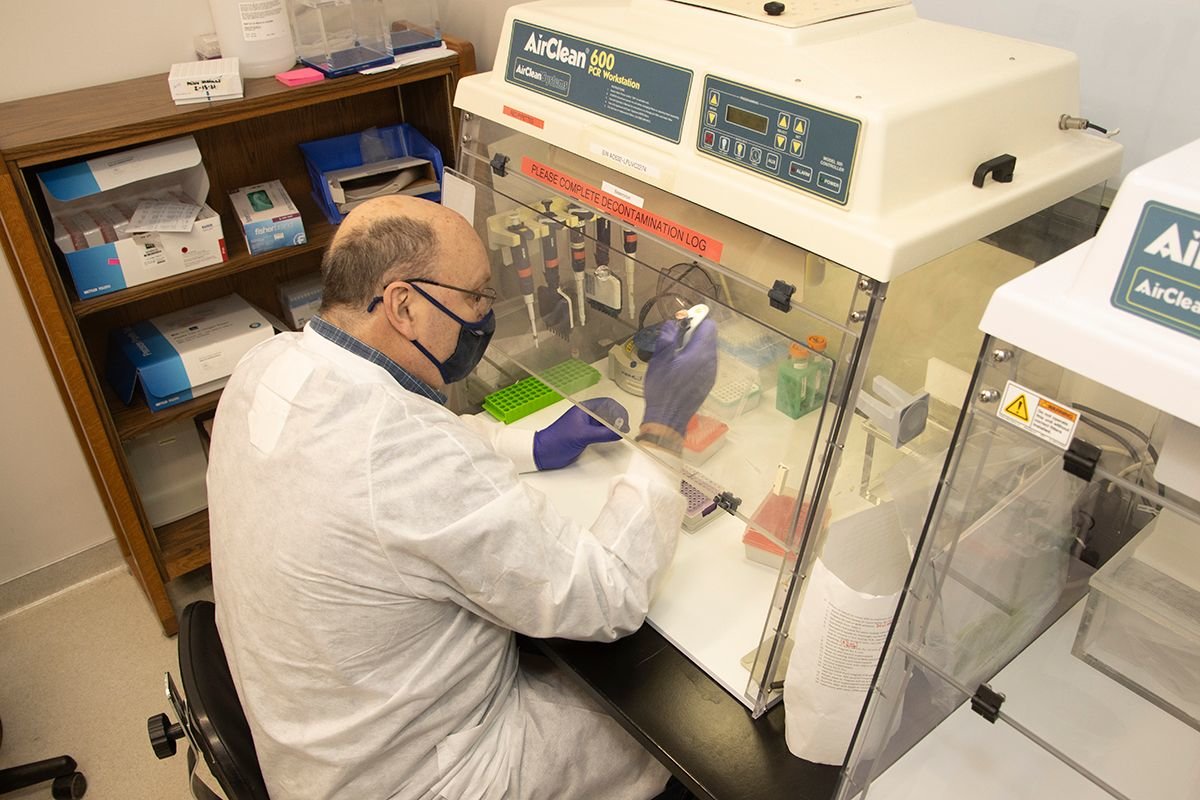 Steve Dietrich performs sample preparation for genome sequencing of SARS-CoV-2.