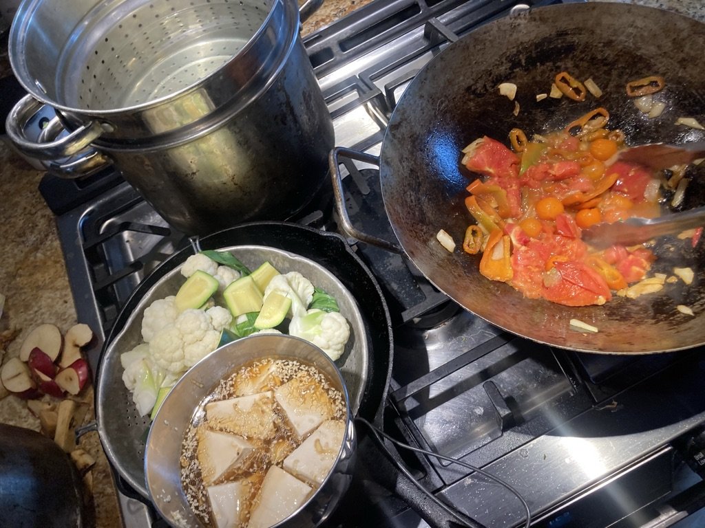 A stir-fry with tofu and fresh vegetables being prepared by Ari LeVaux.