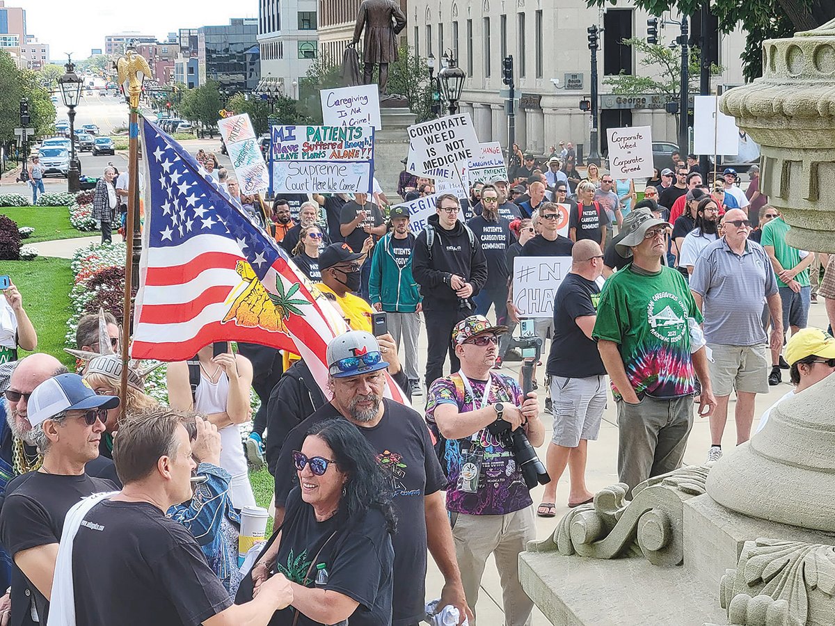 Cannabis activists gathered at the Capitol to protest proposed legislation that reduces the number of plants and patients marijuana caregives can have.