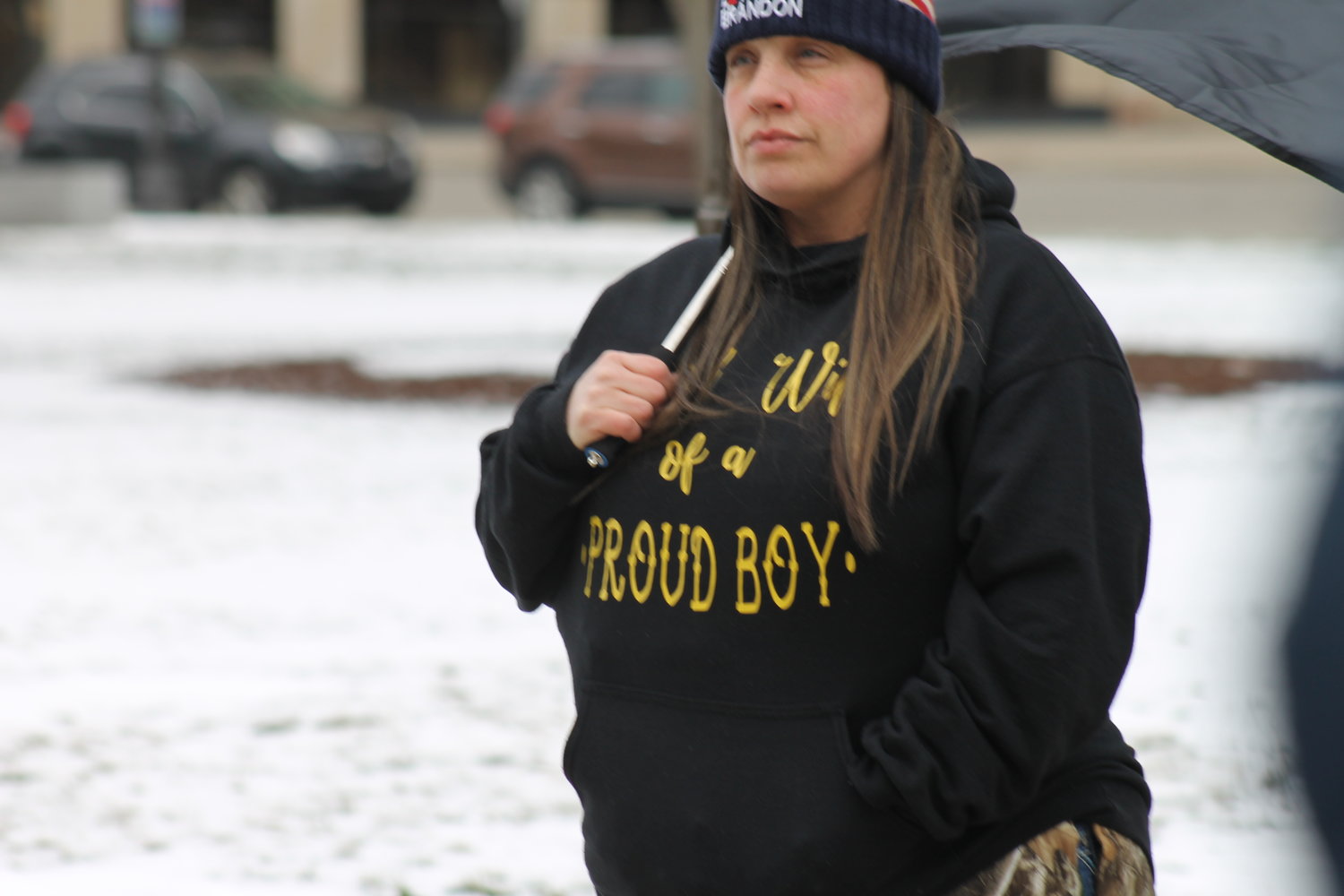 A woman at the rally is a proud wife of a member of the Western Chauvinist group Proud Boys. Some members of the organization have been charged with conspiracy for their roles in the Jan. 6 2021 insurrectionist Capitol riots.