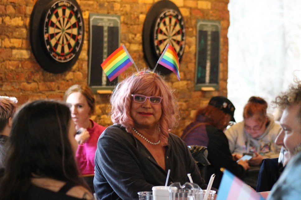 Jessica Shepard of Owosso celebrates International Transgender Day of Visibility Thursday at Sir Pizza in Lansing's Od Town..