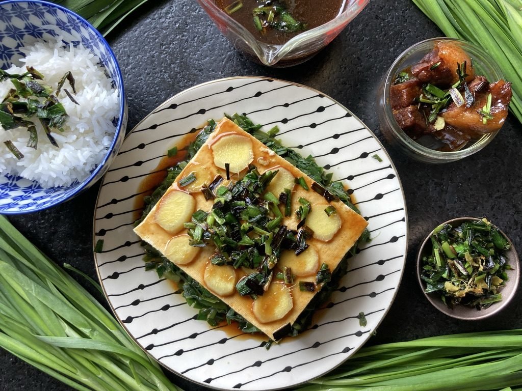 A plain tofu brick wonderfully absorbs the flavor of garlic chives.