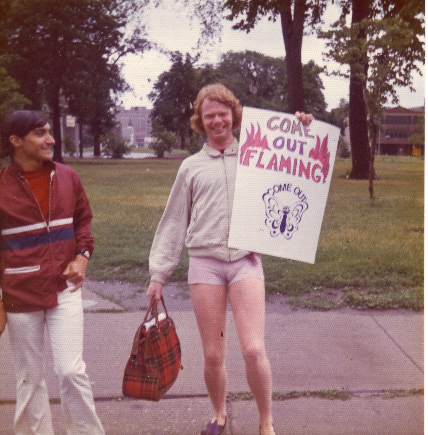 Dan Vigliarolo and Greg Williams (with sign) assemble for the Christopher Street Detroit ’72 march, June 24, 1972.