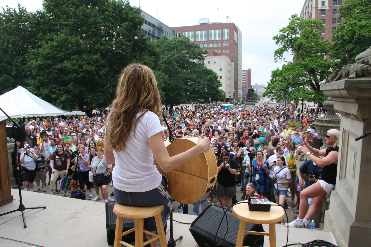 “Large crowd assembles at the Capitol for a rally and speech from Grand Marshal Shelly Wright, the first Country and Western singer to publicly come out. 2010.”