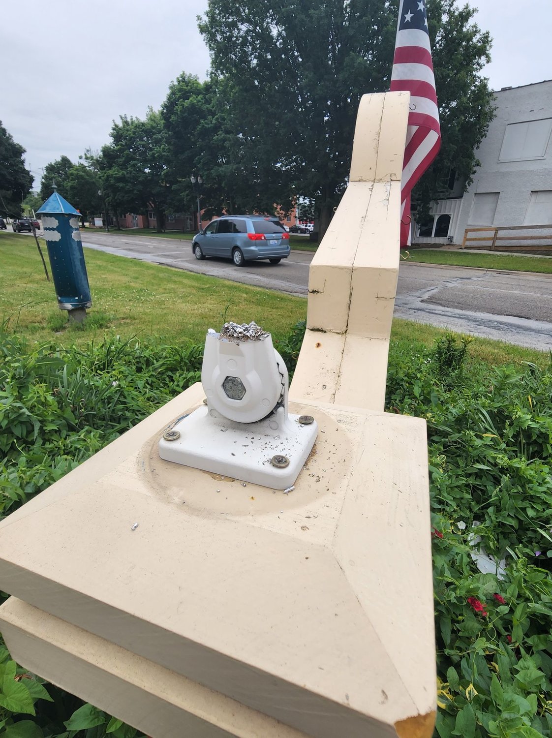 Remnants of a sawed-off flag pole that held a Pride flag on the east side near the U.S.127 underpass on Michigan Avenue. Three Pride flags have disappeared in June, which is Pride month.