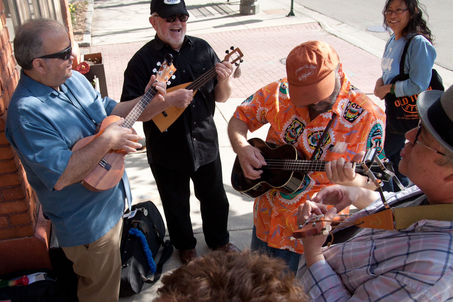Mighty Uke Day showcases world-class ukulele talent and offers public participation strums and workshops. Organizer Ben Hassenger has hosted it since its inception.