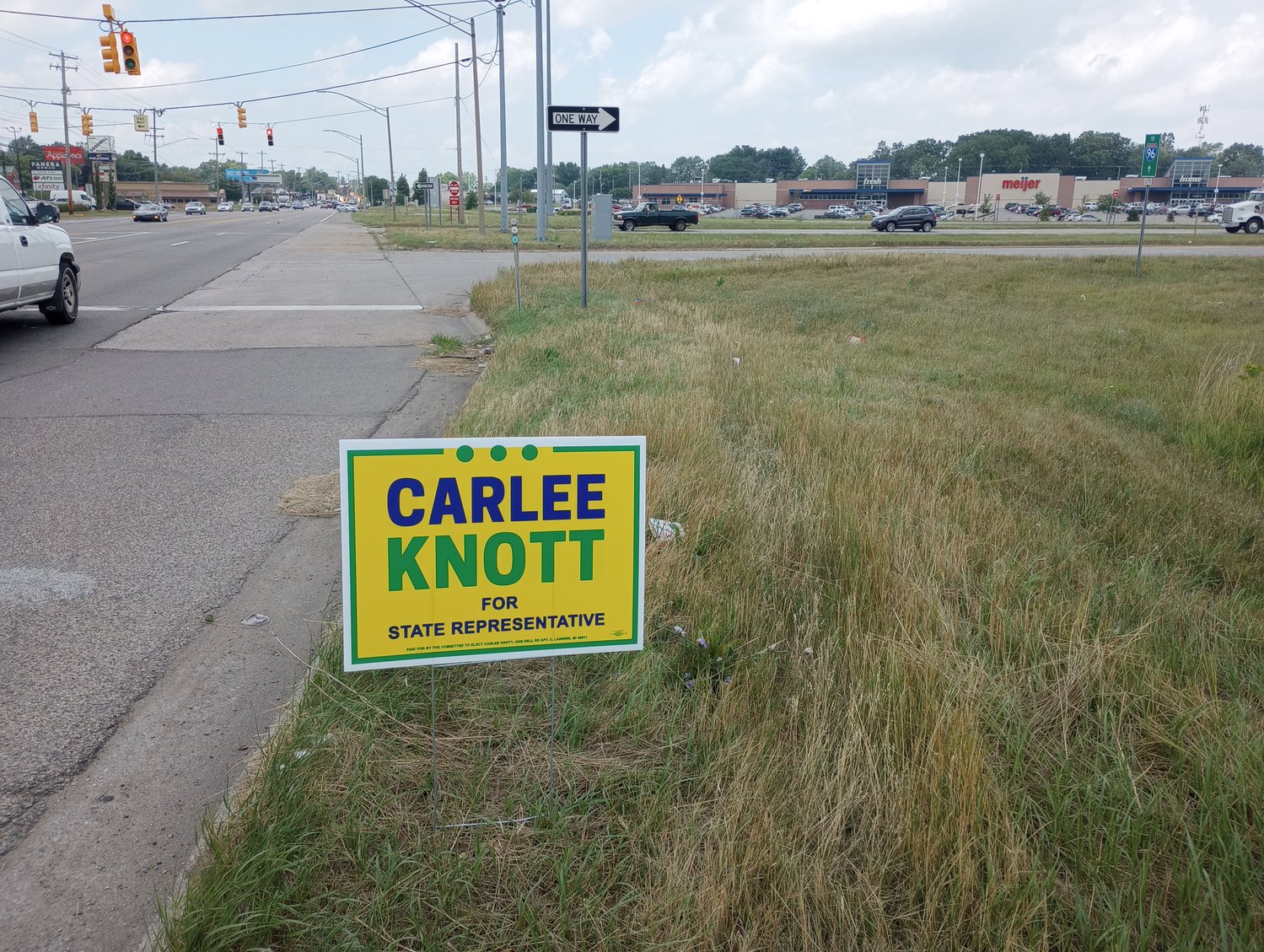 A political sign illegally placed in the right of way on Cedar Street at the on ramp to Interstate I-96 in south Lansing.