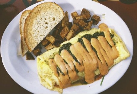 Good Truckin’ Diner’s South by Southwest omelet, with a side of potatoes and toast.