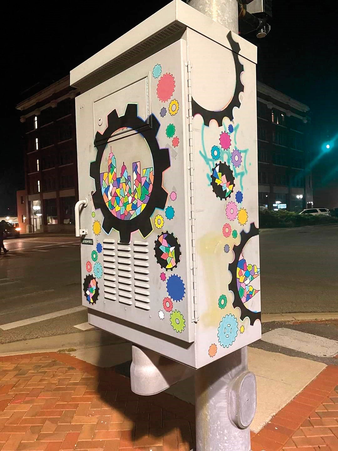 Sisters Sarah Hillman and Rebecca-Lynn Douglas collaborated on a colorful REO Town-inspired traffic box.