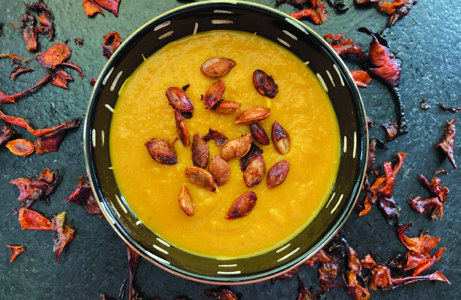 An beta-carotene soup with roasted squash seeds and peels.