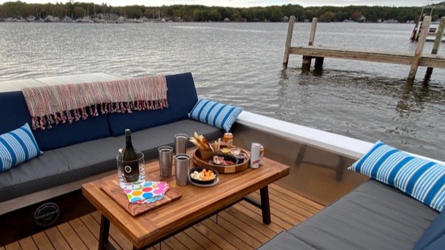 A Lilypad boat is loaded with snacks and beverages.