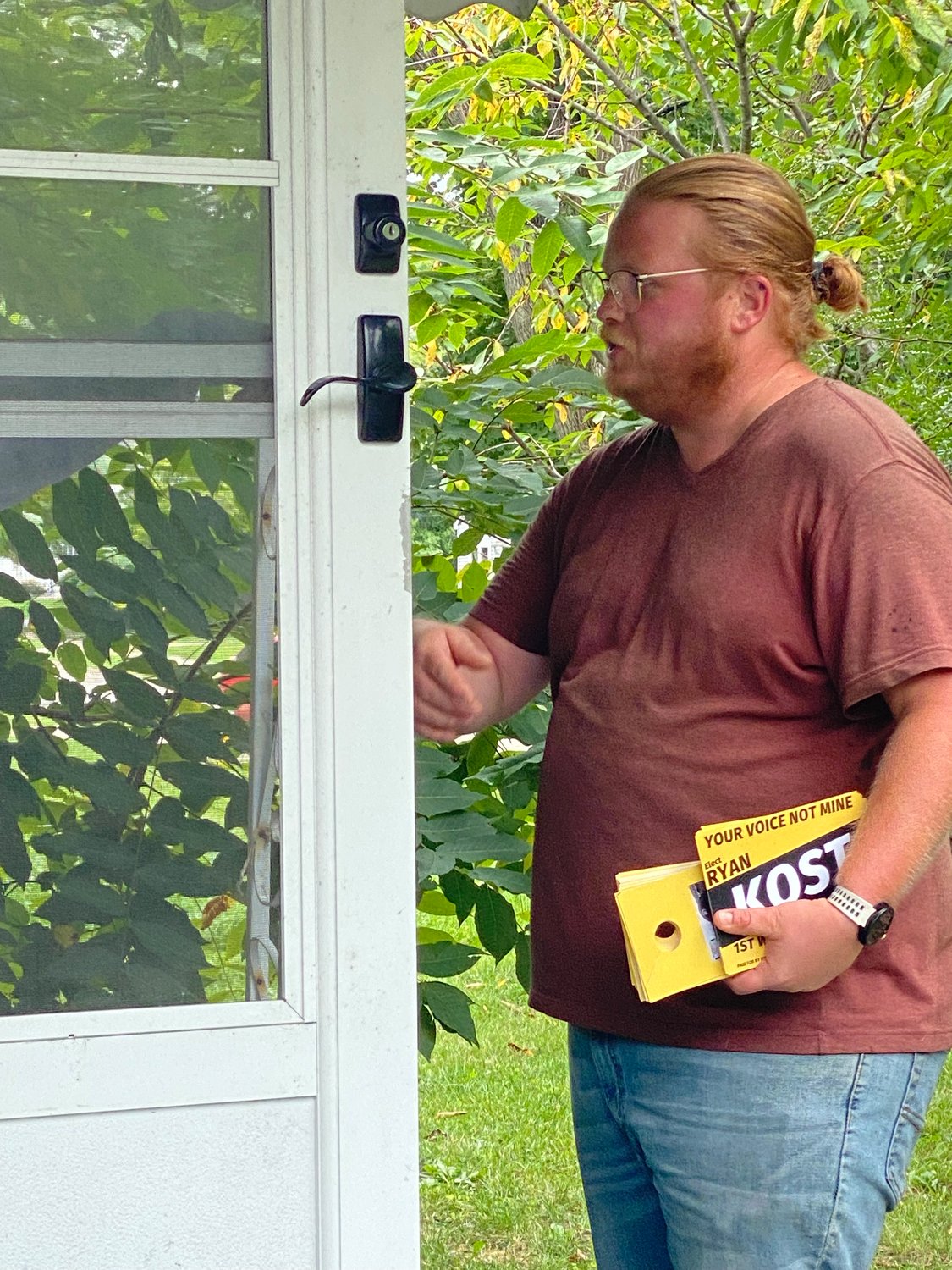 Ryan Kost working the doors in September in his successful campaign to unseat Brian Daniels as the 1st Ward's Lansing City City Council member.