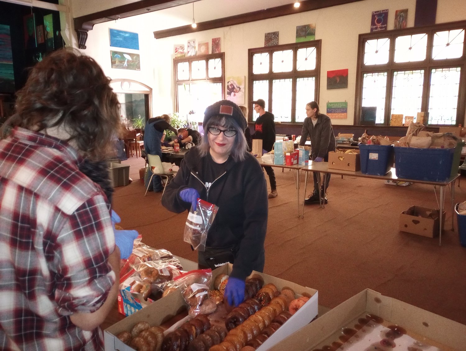 Julia Miller, one of the founders of Punks With Lunch and voted the No. 2 Best Activist in the Top of the Town Contest, helping assemble lunch bags for the homeless at The Fledge on a recent Saturday.
