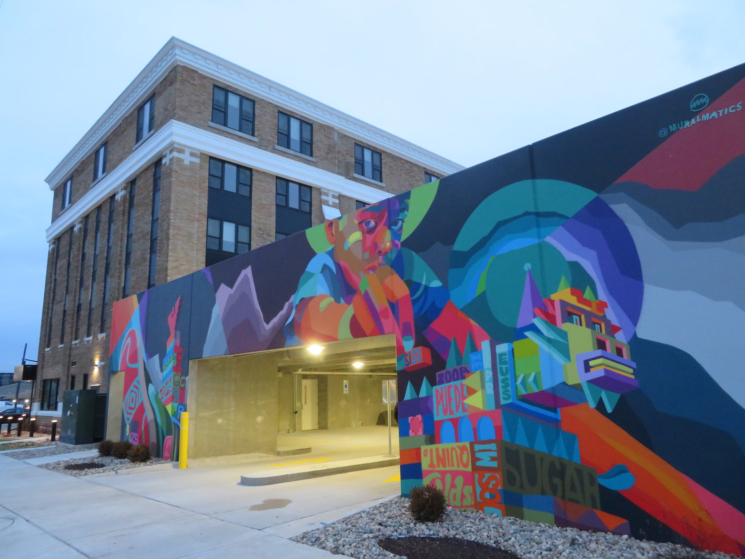 The parking garage is graced with a mural by Lansing artist Dustin Hunt that celebrates North Lansing history, with visual shout-outs to surrounding businesses like Zoobie’s, Preuss Pets and Elderly Instruments.