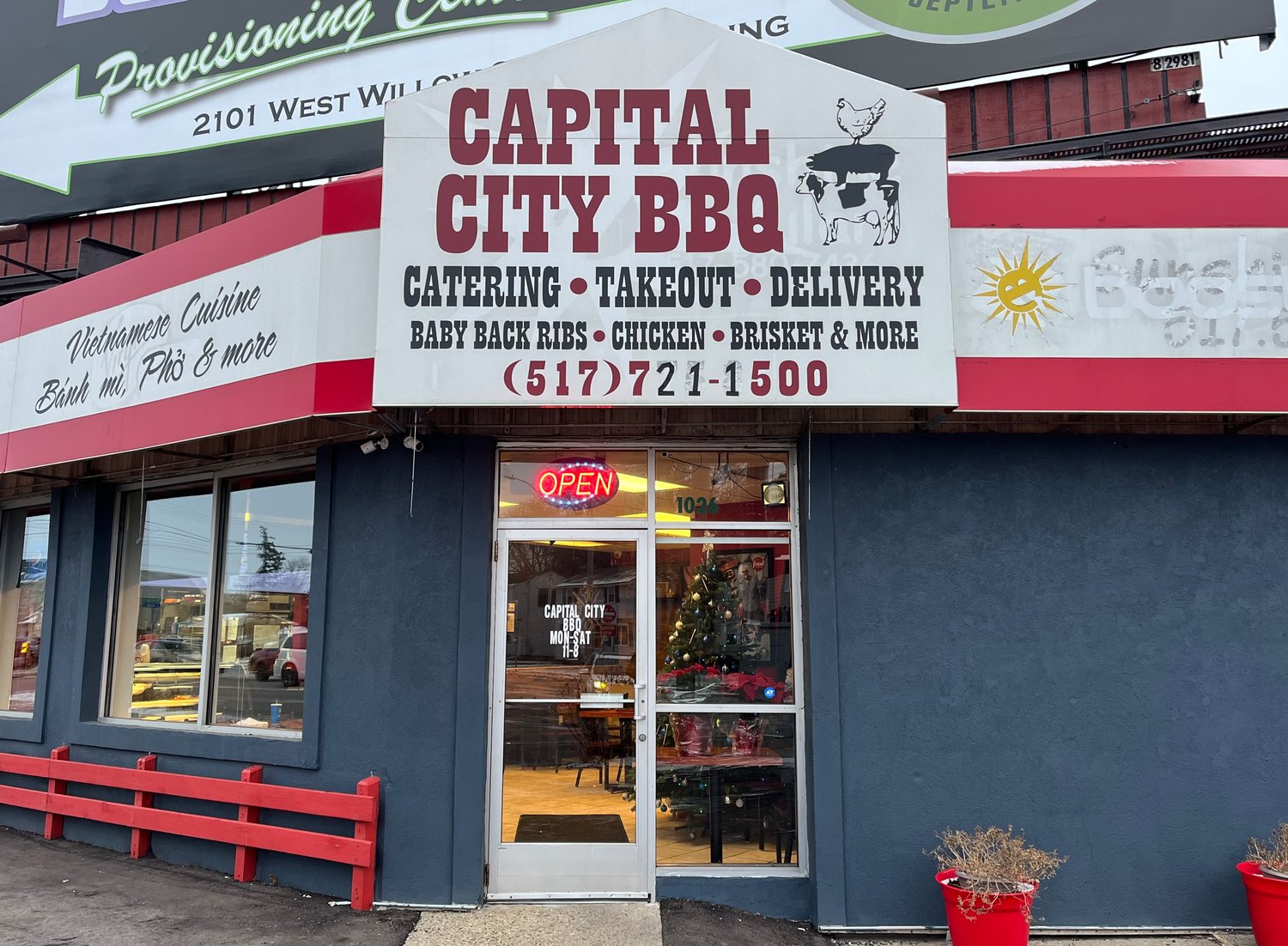 Though its facade has been renovated, you can still make out the remnants of the original cell phone store banner on the front of Capital City BBQ.