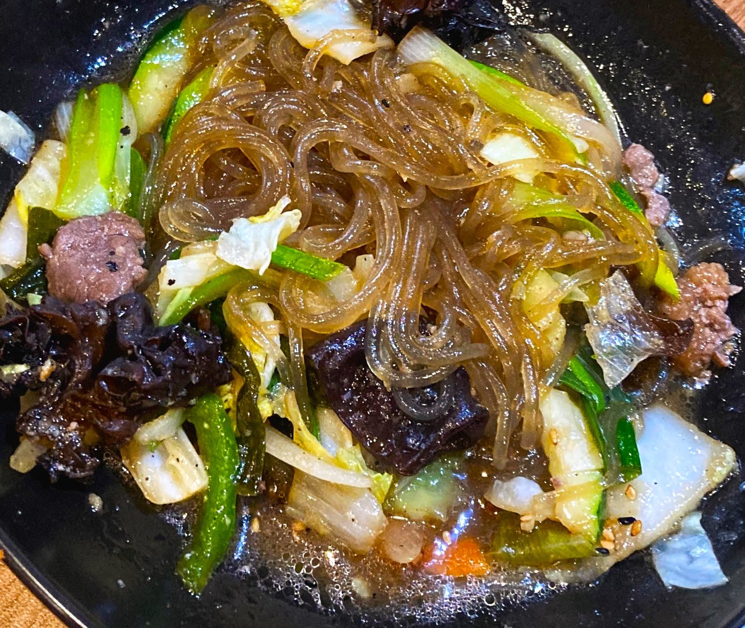 Japchae, a Korean dish consisting of stir-fried glass noodles, meat and assorted vegetables, wows with its unique textures and flavors.