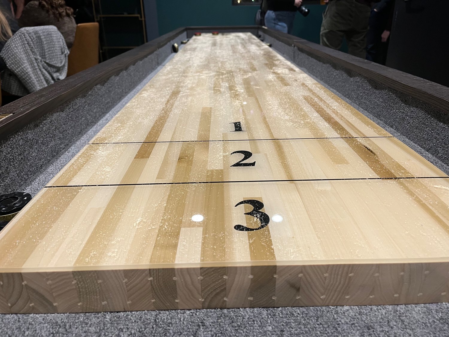 The Boardroom, the Shuffle’s private event lounge, comes with its own tabletop version of shuffleboard.