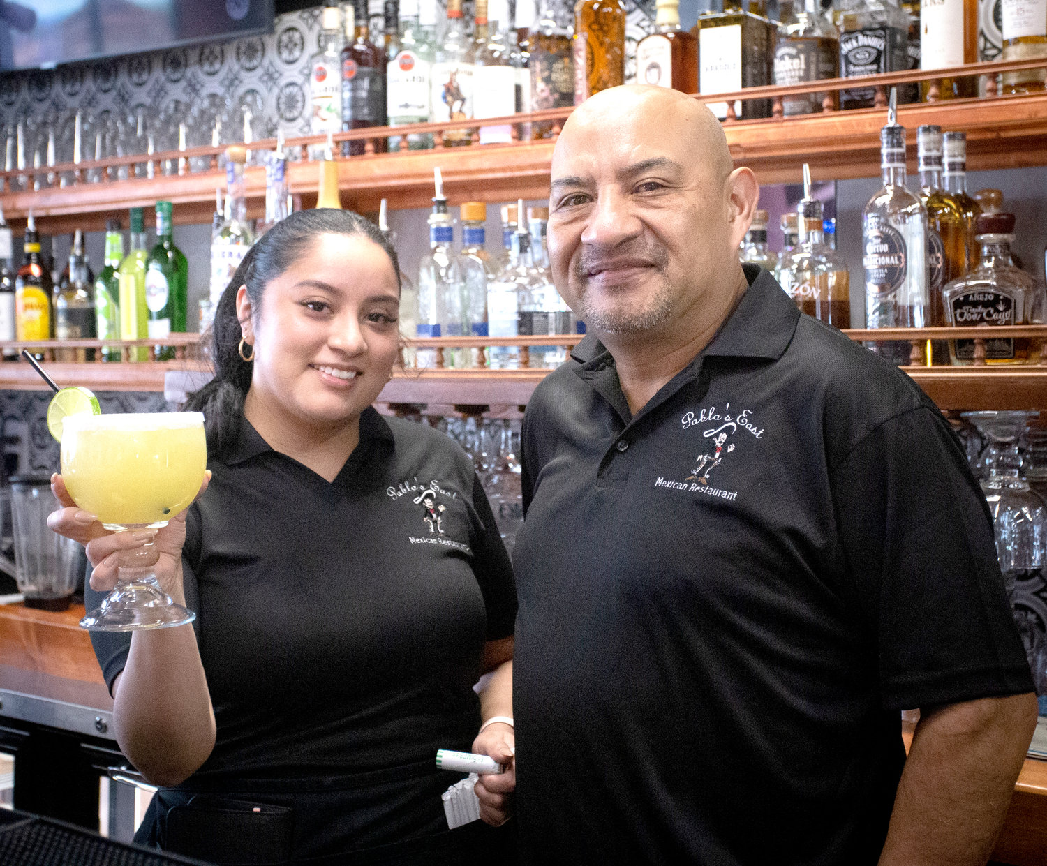 Maldonado with his daughter, Jacqueline, who has been working on her bartending skills. “At the first location, we don’t serve alcohol, so we really had to learn everything that goes into it,” she said.