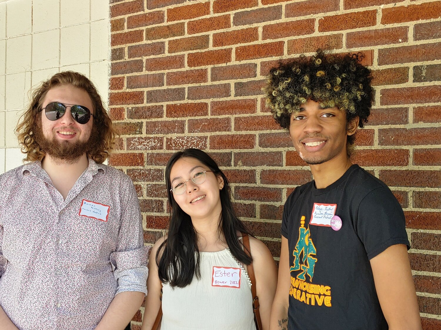 The 50th-year reunion of the Spartan Housing Cooperative attracted some 40 people to Potter Park in Lansing on Saturday, including (from left) current “co-operators” Rowan Price, Ester Lee and Clay Griffith, who is this year’s president. 