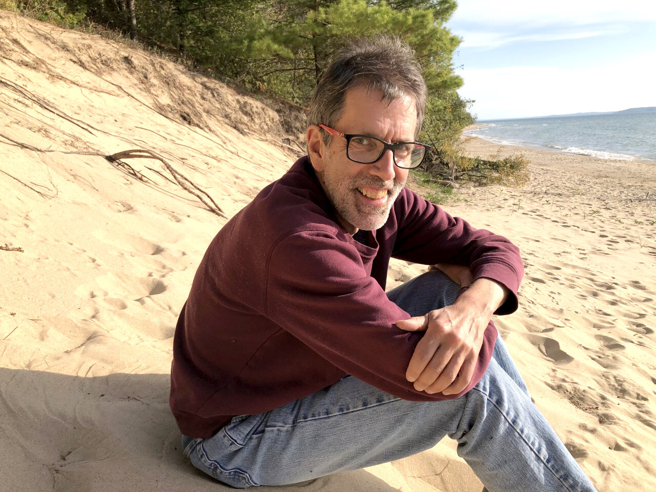 Dave Dempsey, author of “The Great Lakes: Fact or Fake,” on the shores of Grand Traverse Bay.