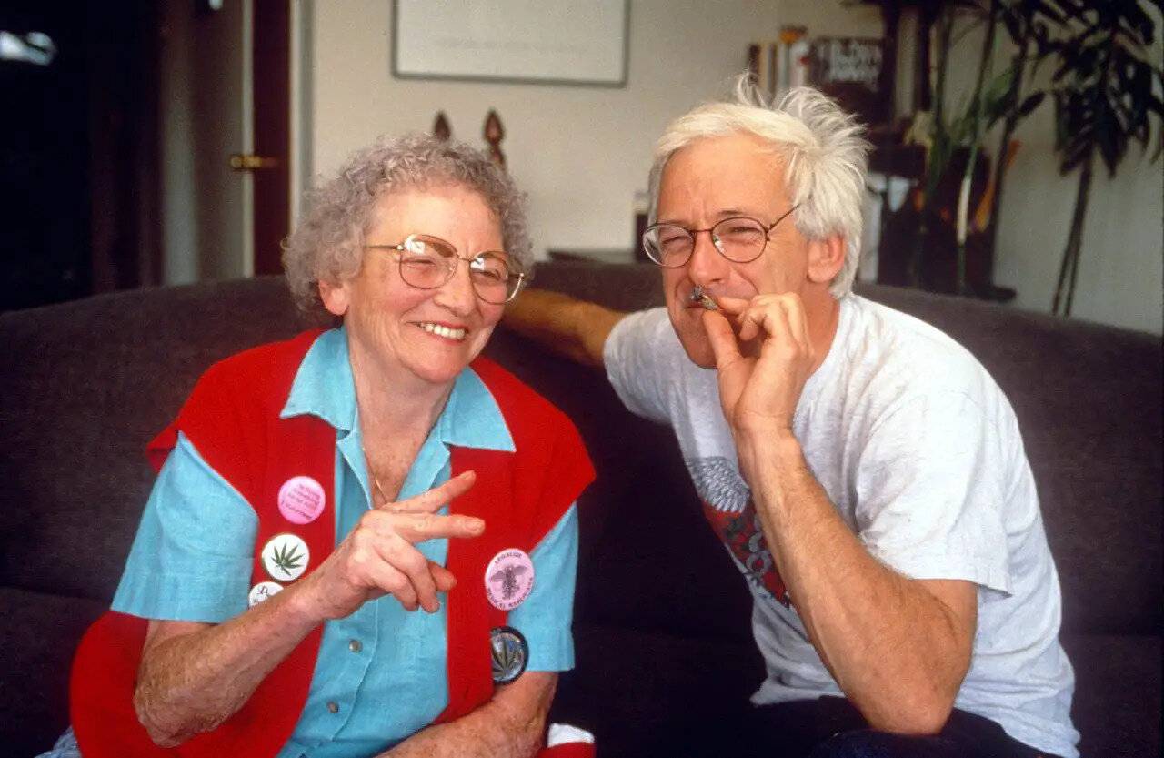 Mary Jane Rathbun and cannabis activist Dennis Peron share a toke together in 1993.