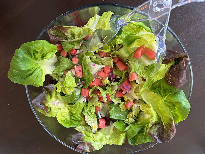 You don’t need to get fancy with watermelon salad. A simple dressing of white vinegar and brown sugar allows the ingredients to speak for themselves.