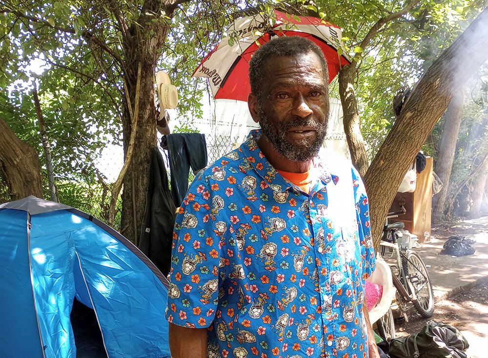 Victor Lyons, 61, of Lansing, in the tent encampment he calls home.