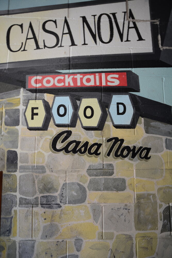 A Gary Glenn mural can still be seen in the entrance to Falsetta’s Casa Nova on South Waverly Road.