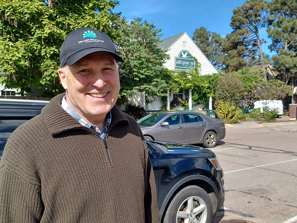 Al Bay, owner of the Wild Goose Inn, in the public parking on Albert Street in East Lansing that he and other business owners are fighting to keep from being developed into housing. The City Council is expected to decide on Tuesday (Oct. 17).