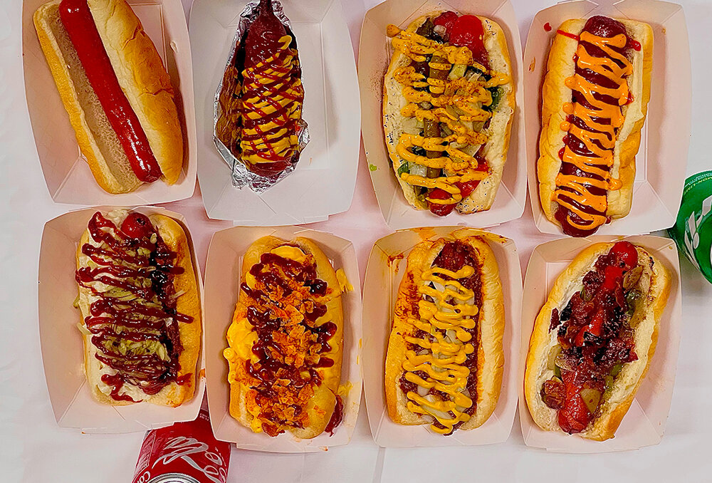 University Weiner’s menu features eight signature hot dogs, ranging from the completely bare Raw Dog to the bacon, mac and cheese and potato chip-loaded MAC Ave dog, plus the Weiner on a Stick.