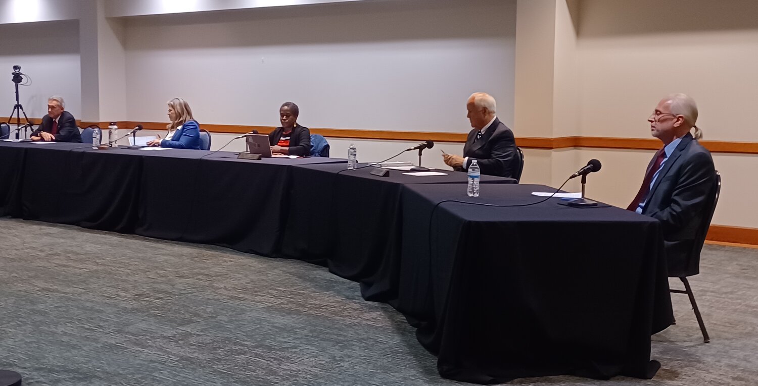 (From left) East Lansing City Council members Mark Meadows, Kerry Ebersole Singh, Dana Watson, George Brookover and Erik Altmann are seated for the first time following last week's election.