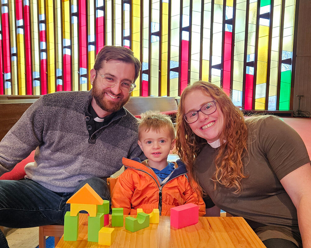 University Lutheran Church’s new pastors, Zachariah and Emily Shipman, play with their son, Theo, at one of the church’s children’s tables following their interview with City Pulse.