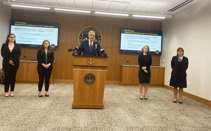 R.I. Attorney General Peter Neronha, surrounded by his legal team, announcing the decision in 2021 to approve the transfer of ownership of Prospect Medical Holdings for two Rhode Island hospitals, conditioned on the creation of an $82 million escrow account.