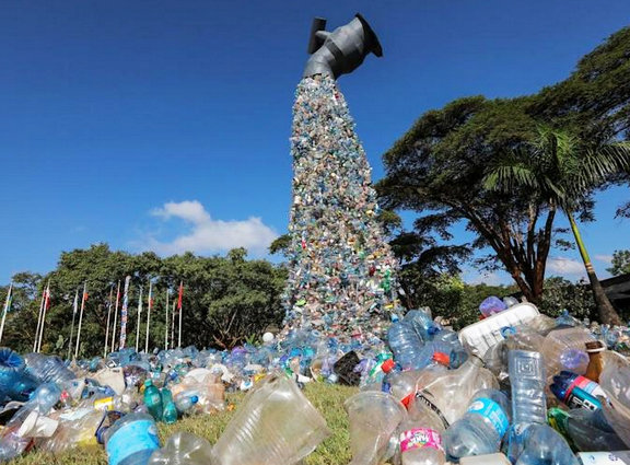 A sculpture installed by Benjamin Von Wong, outside the UNEA meeting in Kenya, a floating spigot with a torrent of locally gleaned plastic waste.