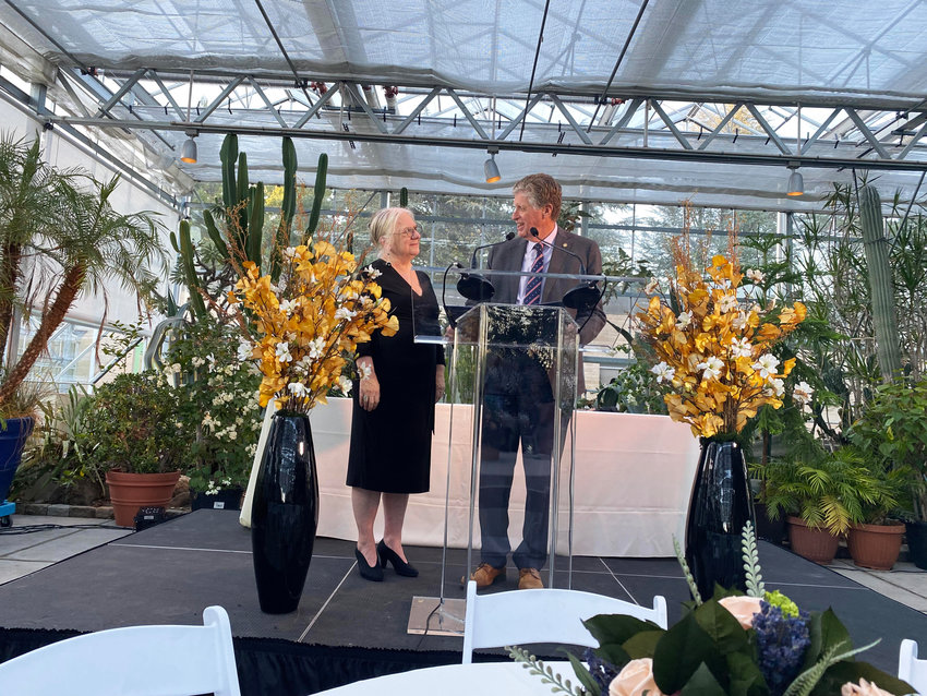 Linda Hurley, president and CEO of CODAC Behavioral Healthcare, left, and Gov. Dan McKee, at the 50th anniversary gala held on Thursday, Oct. 6, at the Roger Williams Park Botanical Garden