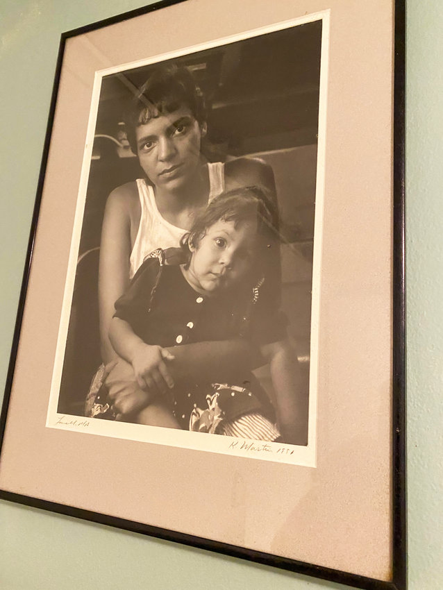 Photograph of a homeless woman and her child seeking legal assistance in 1991