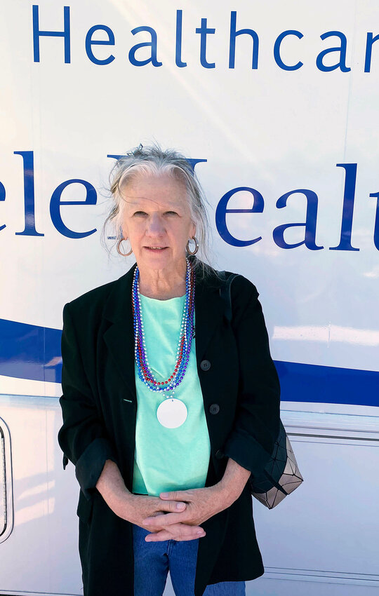 Linda Hurley, CEO of CODAC, in front of the agency&rsquo;s mobile recovery unit at the Rally4Recovery.