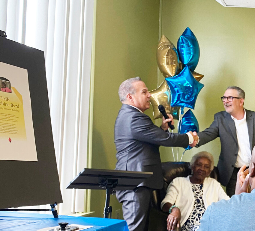 David Cicilline, left, president and CEO of the RI Foundation, at the ceremony honoring Josie Byrd, center, with Benedict Lessing, Jr., president and CEO of the Community Care Alliance in Woonsocket in June.