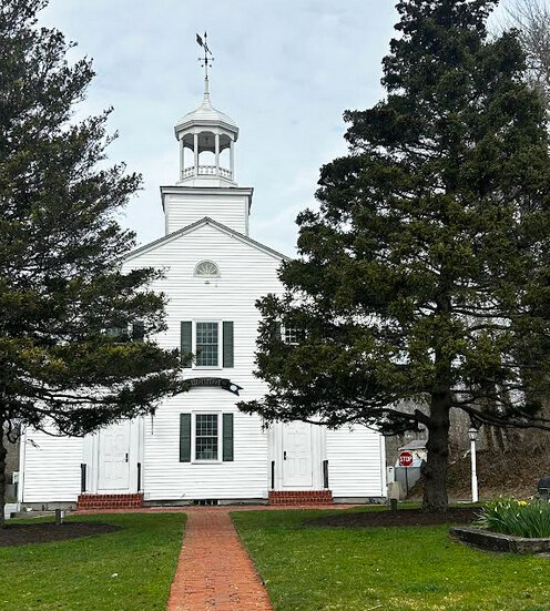 Small town life often revolves around the town hall in Wellfleet, Mass., where conversations and services provide a sense of connection in a post-Covid world.