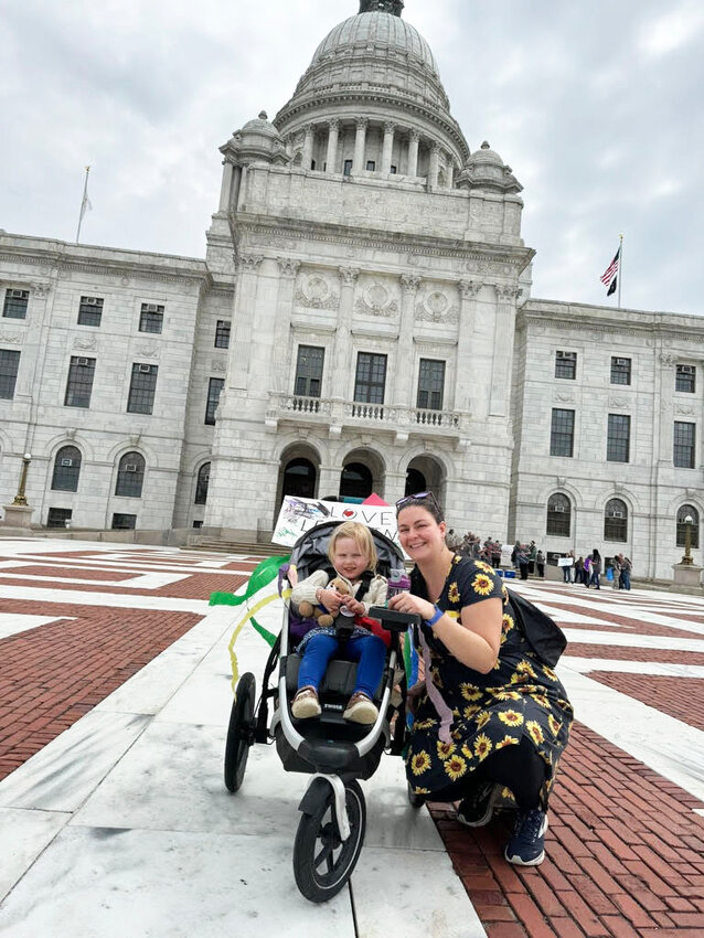 As part of the lobbying effort at the State House, Alison Weber, MPH, Ph.D. student at the Brown School of Public Health, was accompanied by her daughter as one of the state's littlest advocates to support equitable policies for parents, babies and toddlers.