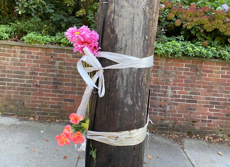 The impromptu memorial on Olney Street in Providence to Miya Brophy-Baermann, who was murdered in a drive-by shooting in 2021.